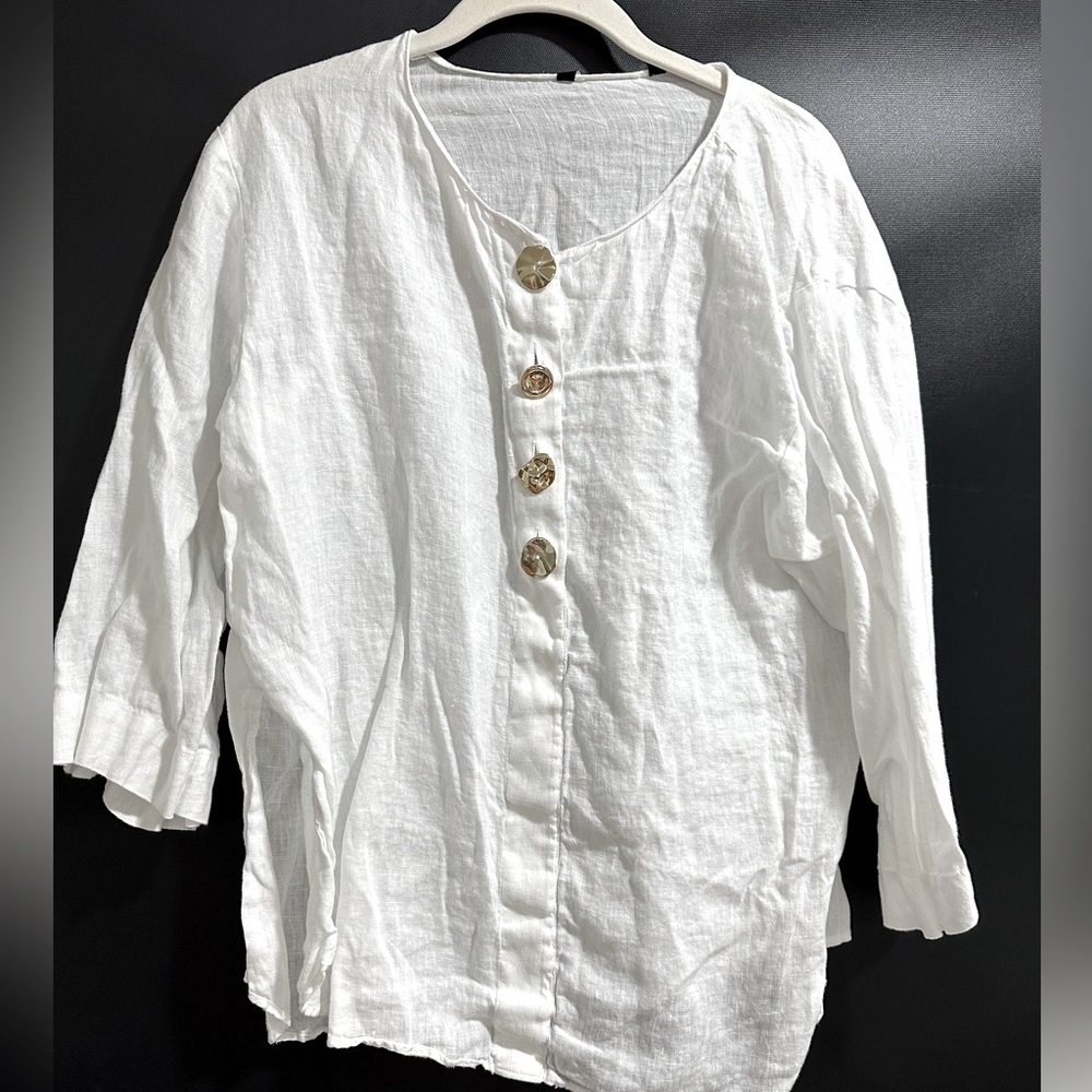 White blouse with gold buttons